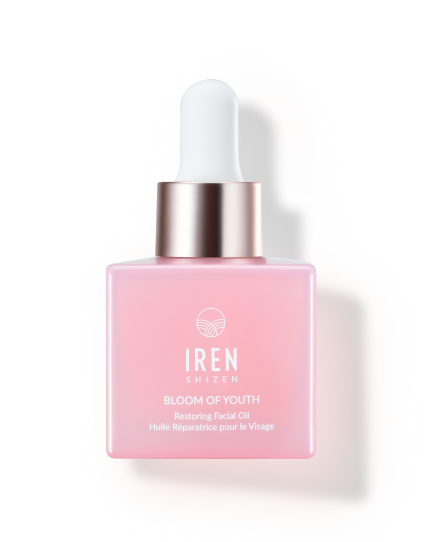 A bottle of IREN Shizen's BLOOM OF YOUTH Restoring Facial Oil, a Japanese skincare product, on a white background.