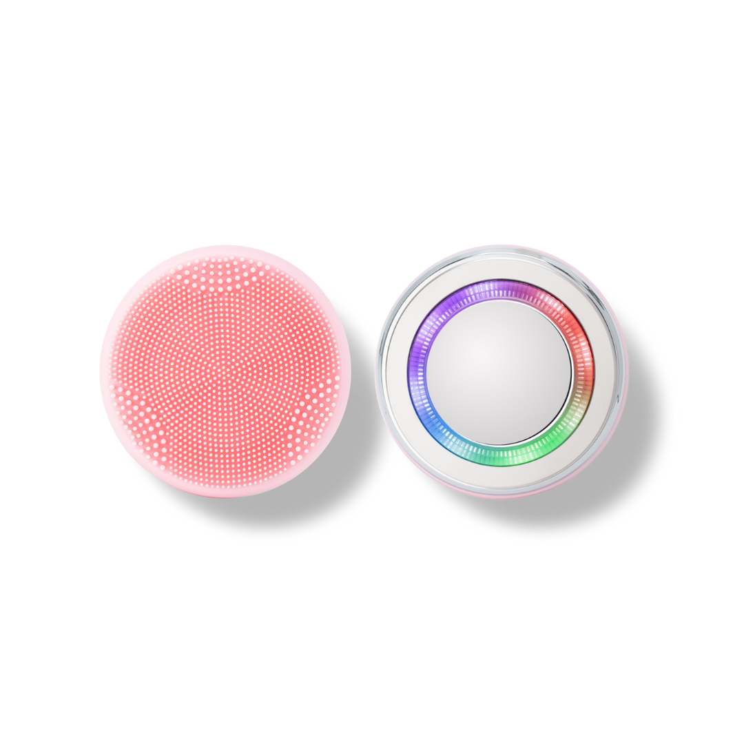 A pink and white SKIN GENIE PRO Cleansing Brush + LED Light Therapy button on a black background, offering customized skincare.